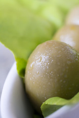 Olives in lettuce leaf