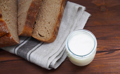 Home-made bread on wooden background