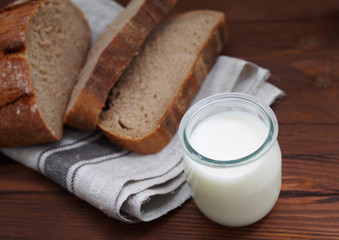 Home-made bread on wooden background