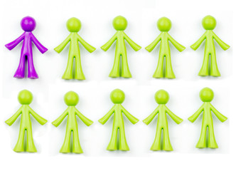 Ten pieces of generic, human shaped plastic pieces in green and purple. One piece is purple, nine pieces are green. Could indicate a demographic of 10% or 90%. Background shadows for depth.