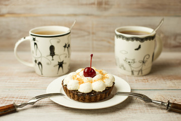 Two Cup of tea and cake  on the table