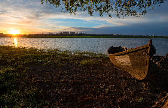 Old fishing boat at sunset