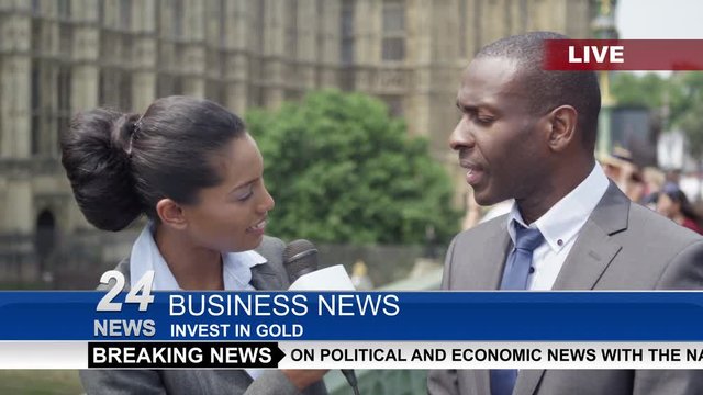  News reporter interviewing businessman or politician in city of London 