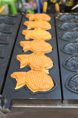 Sweet dessert with shape fish on the oven.