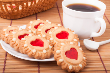 cookie with heart  jelly and cup of coffee bamboo napkin