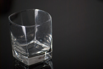 Whiskey Glass - Scotch Glass with background and shinny reflection on bottom