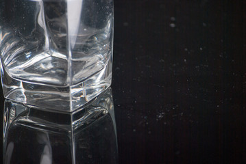 Whiskey Glass - Scotch Glass with background and shinny reflection on bottom