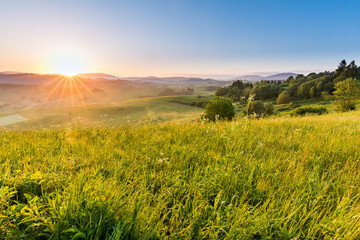 Fototapeta na wymiar Fields and hills at sunrise near Dolny Kubin in Slovakia