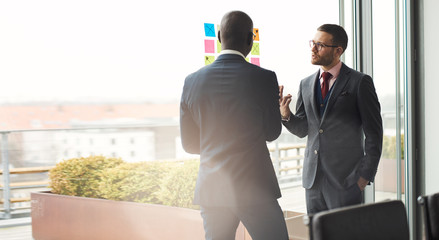Two business executives in an animated discussion