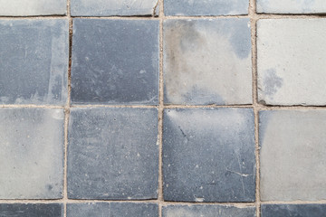 Close-up of a dusty and smooth paving viewed from above.