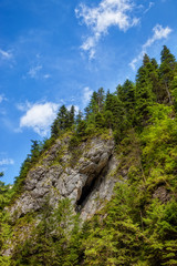 Rock cave entrance in the side of a mountain. Tatras, Poland.