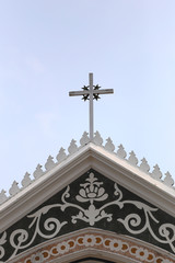 crucifix on roof architecture of the church on clear day.
