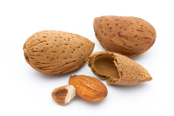 Almonds with leaves isolated on white background