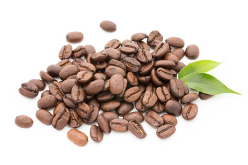 Coffee grains and leaves isolated on the white backgrounds.