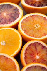 Mixed citrus fruit figs, limes on a gray background.