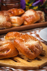 Buns with berries on a wooden table.