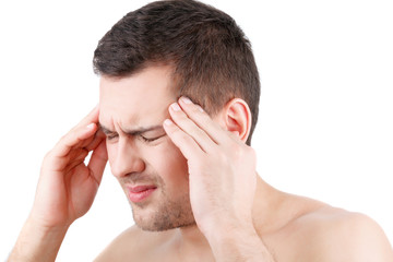 Fototapeta premium Young guy feels pain in his head