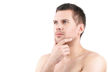 Obraz premium Pensive attractive guy is posing confidently