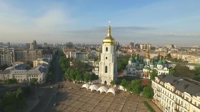 Sophia Cathedral in the Morning Sun.golden Domes, Crosses and Bellsshooting With the Aircraft Quadrocopter.the Camera Flies Over the City. Kiev Bird's-Eye View.early in the Morning the City Wakes Up