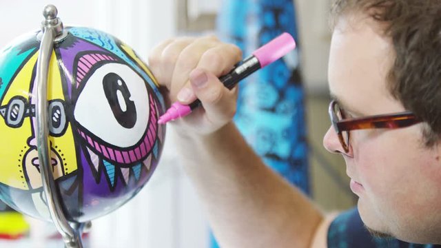  Modern graphic artist at work in his studio