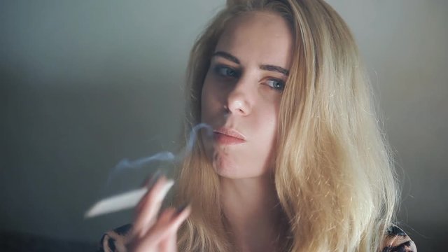  girl blonde smoking cigarette