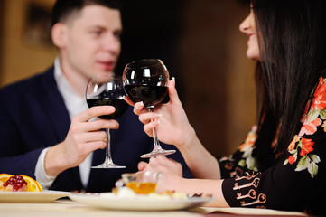 a man with a woman having dinner at a restaurant. couple celebra