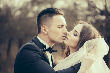 Kissing wedding couple