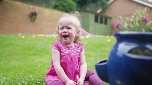  Tears & tantrums - Portrait of little girl crying in the garden