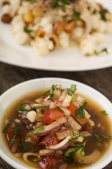 Traditional bowl of ecuadorian encebolladas, very nice presentation, restaurant catering concept, main dish blurry in background