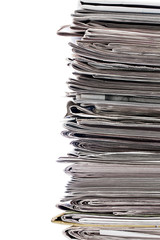 cropped image of a stack of newspaper.