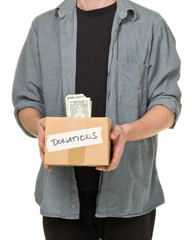 Fototapeta na wymiar Man holding donation cardboard box with dollar banknotes