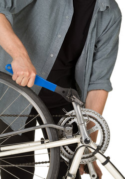 Man fixing pedals on a bicycle