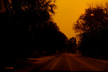 Picturesque landscape scene and sunrise above road