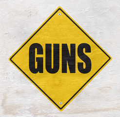 guns sign on wood grain texture