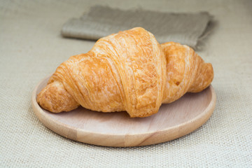 croissants in wood plate