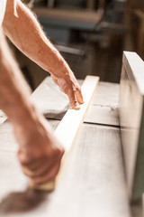 woodworker hands with wooden board