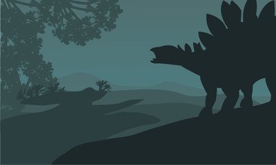Single stegosaurus silhouette in hills