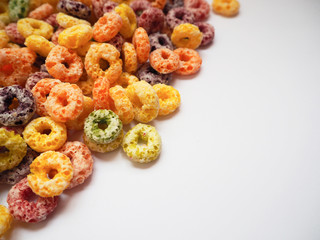 Colorful fruit flavored cereal with space for putting text, selective focus