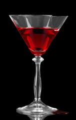 Broken glass with  cocktail isolated on  black background.