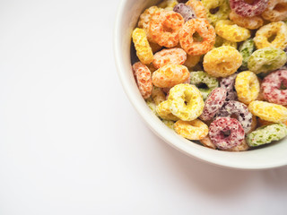 Colorful fruit flavored cereal with space for putting text, selective focus