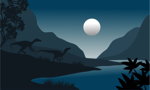 silhouette of eoraptor in riverbank
