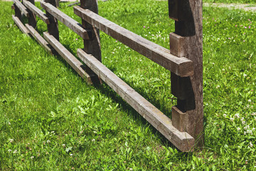 Wooden fence on grassy lawn