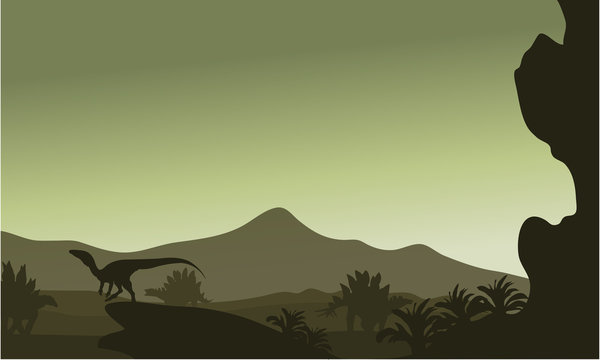 Silhouette of eoraptor in hills