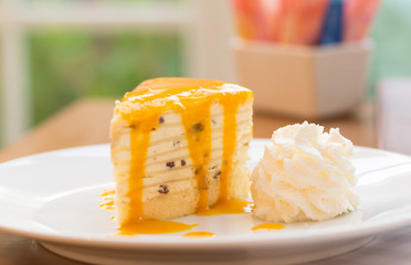 Mango cake serve with whip cream.