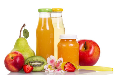 Baby food, puree and fruit juices in glass bottles isolated.