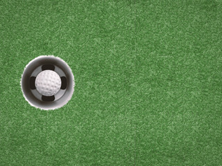golf ball in golf cup on green