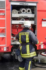 firefighter / Firefighter on a fire truck