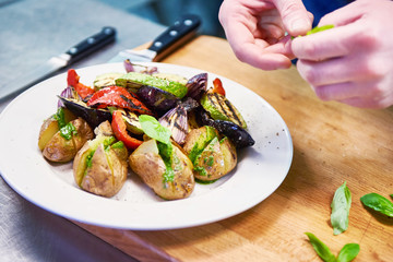 Cooking roasted vegetables potato, eggplant, zucchini, bell pepp