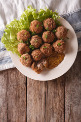 Dutch meat croquettes Bitterballen and mustard close up. vertical top view 
