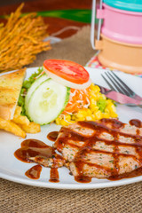 Beef steak with black pepper sauce , salad and French fries on s